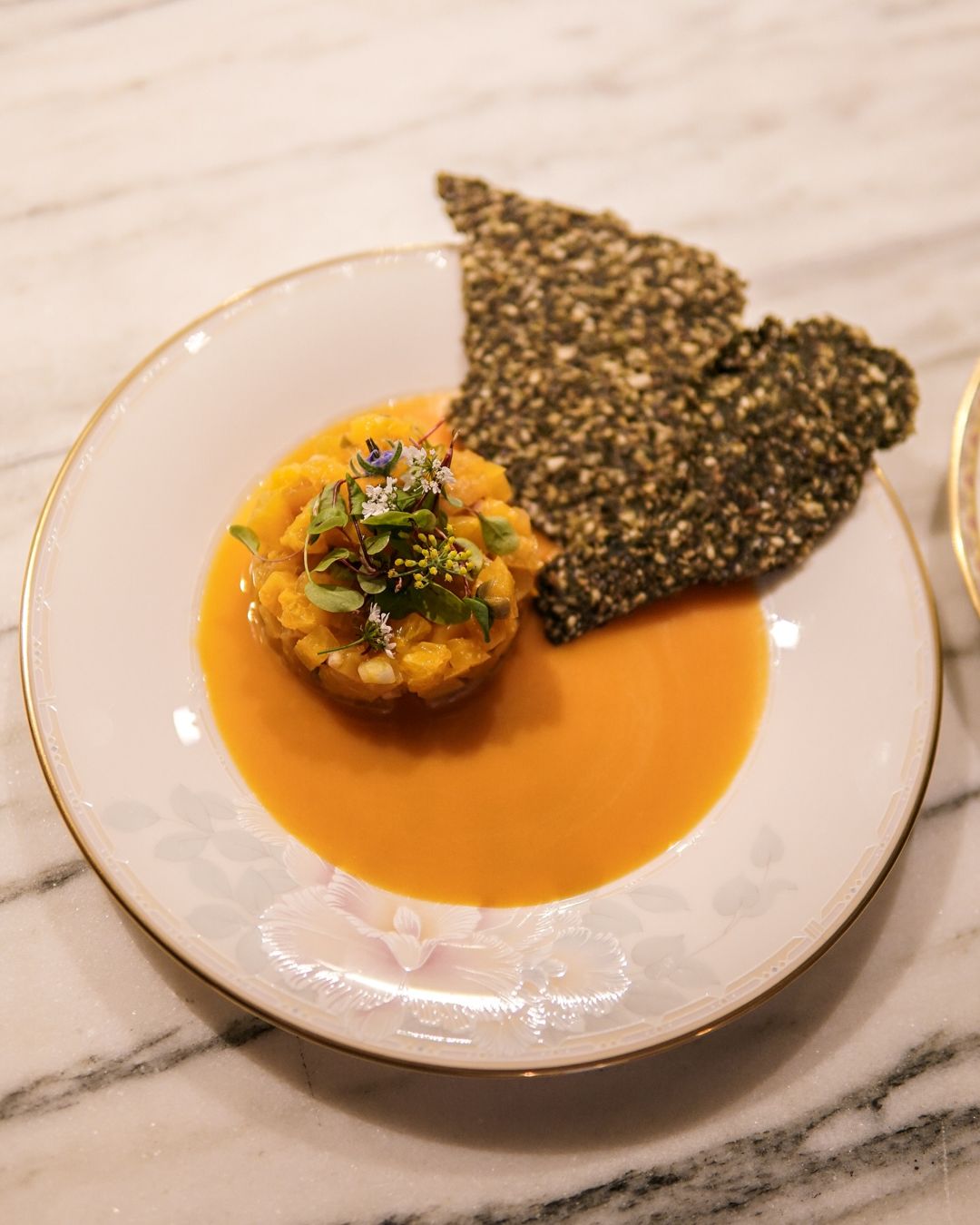 Beet tartare with citrus and a seeded crisp