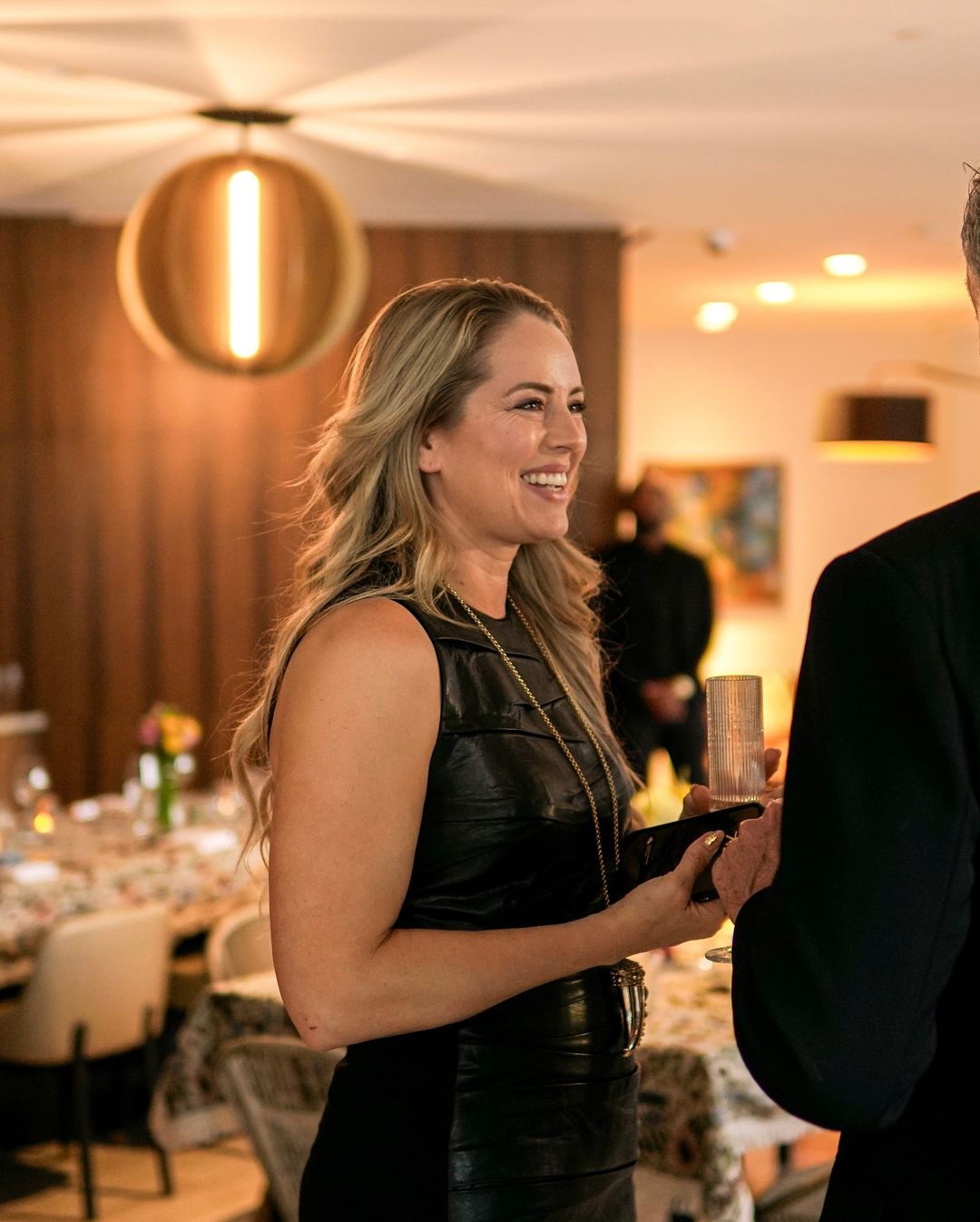 A guest laughing during the cocktail hour