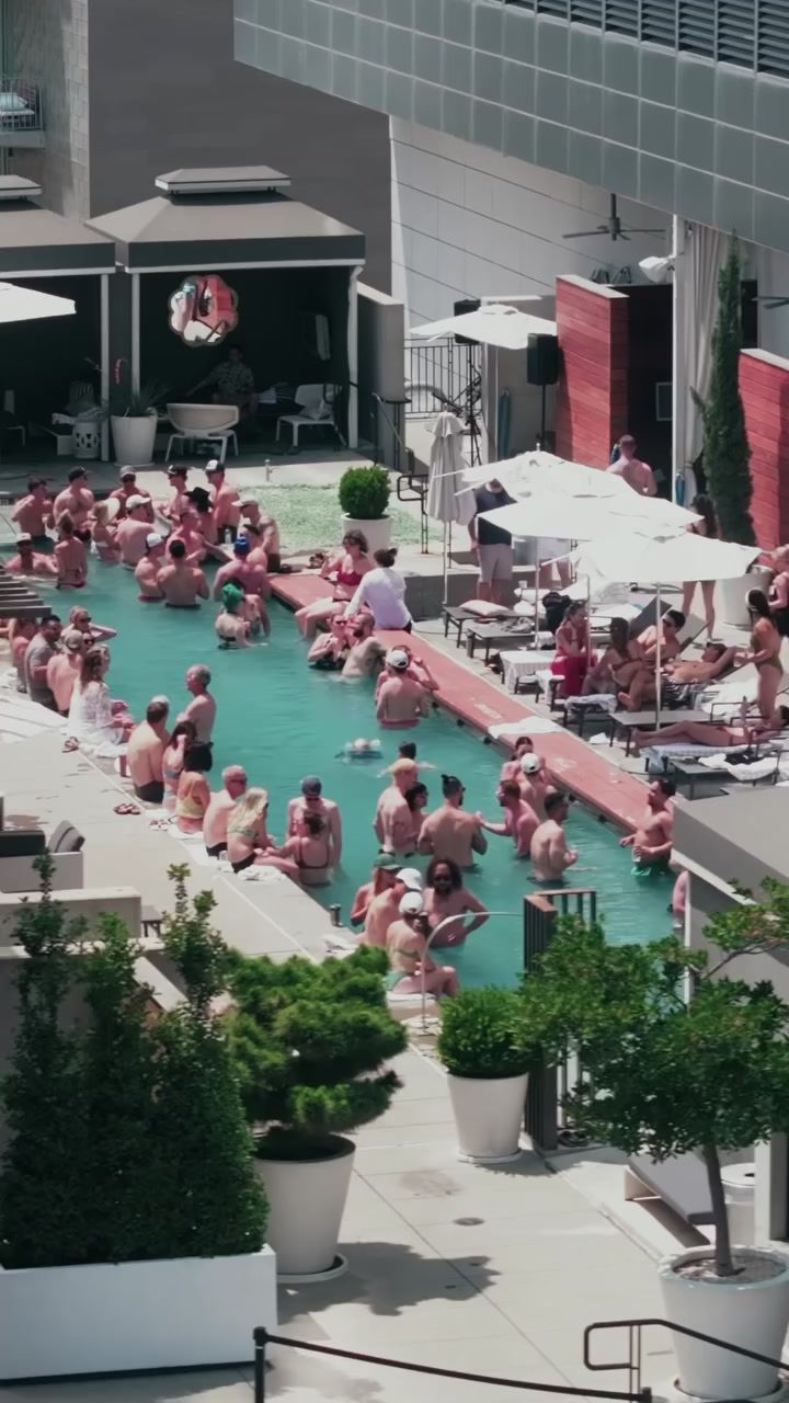Club members by the pool at The W Austin, seen from above